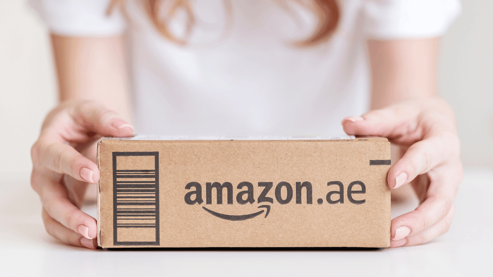 Woman holding a package from Amazon