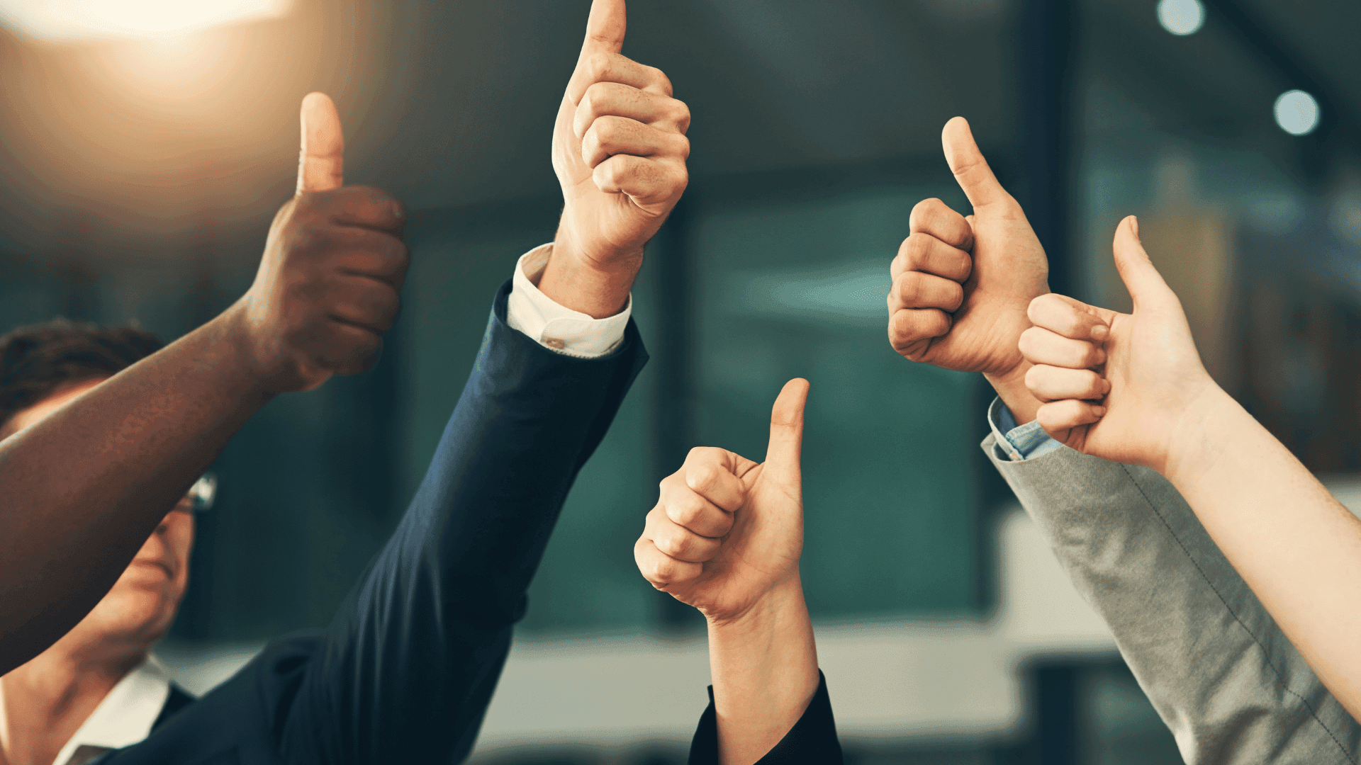 Employees giving thumbs up