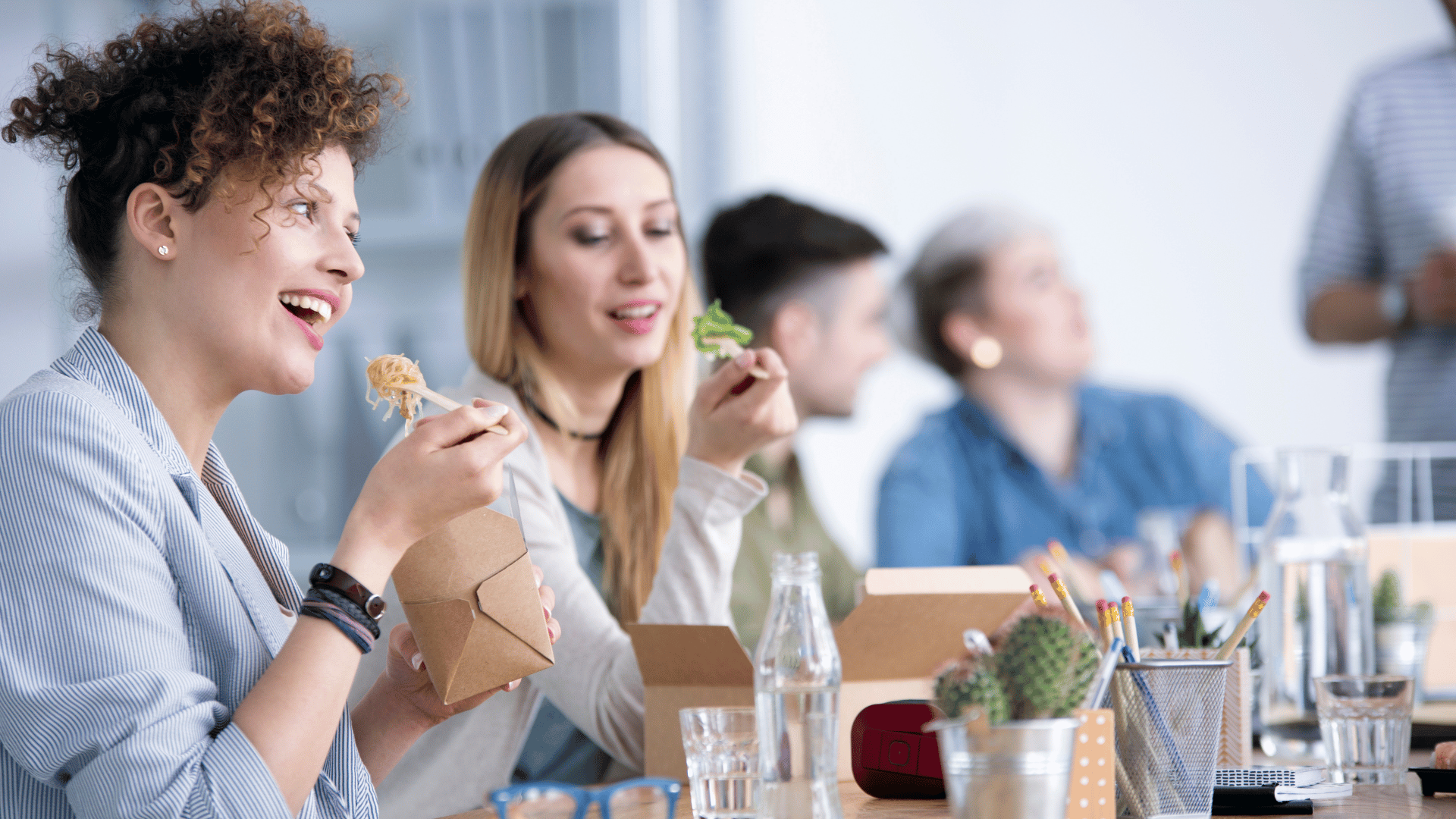 Women eating lunch together in the office
